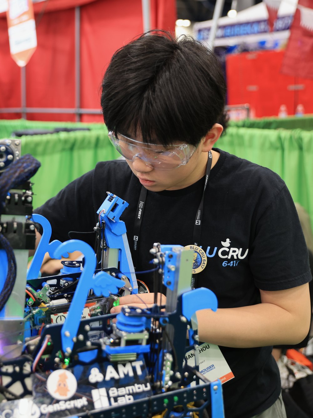 Ethan Zhou working on a competition robot